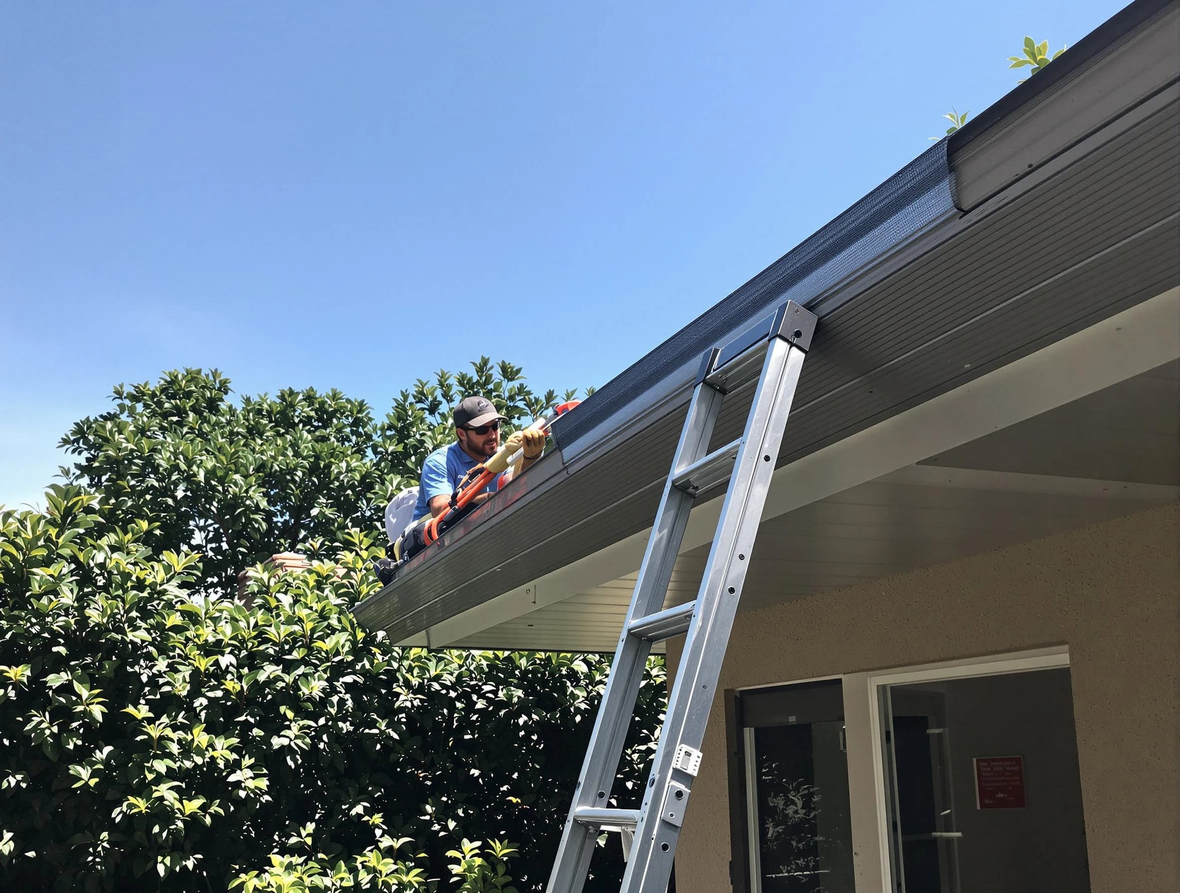 Tallmadge Roofing Company installing gutter guards for a homeowner in Tallmadge, OH